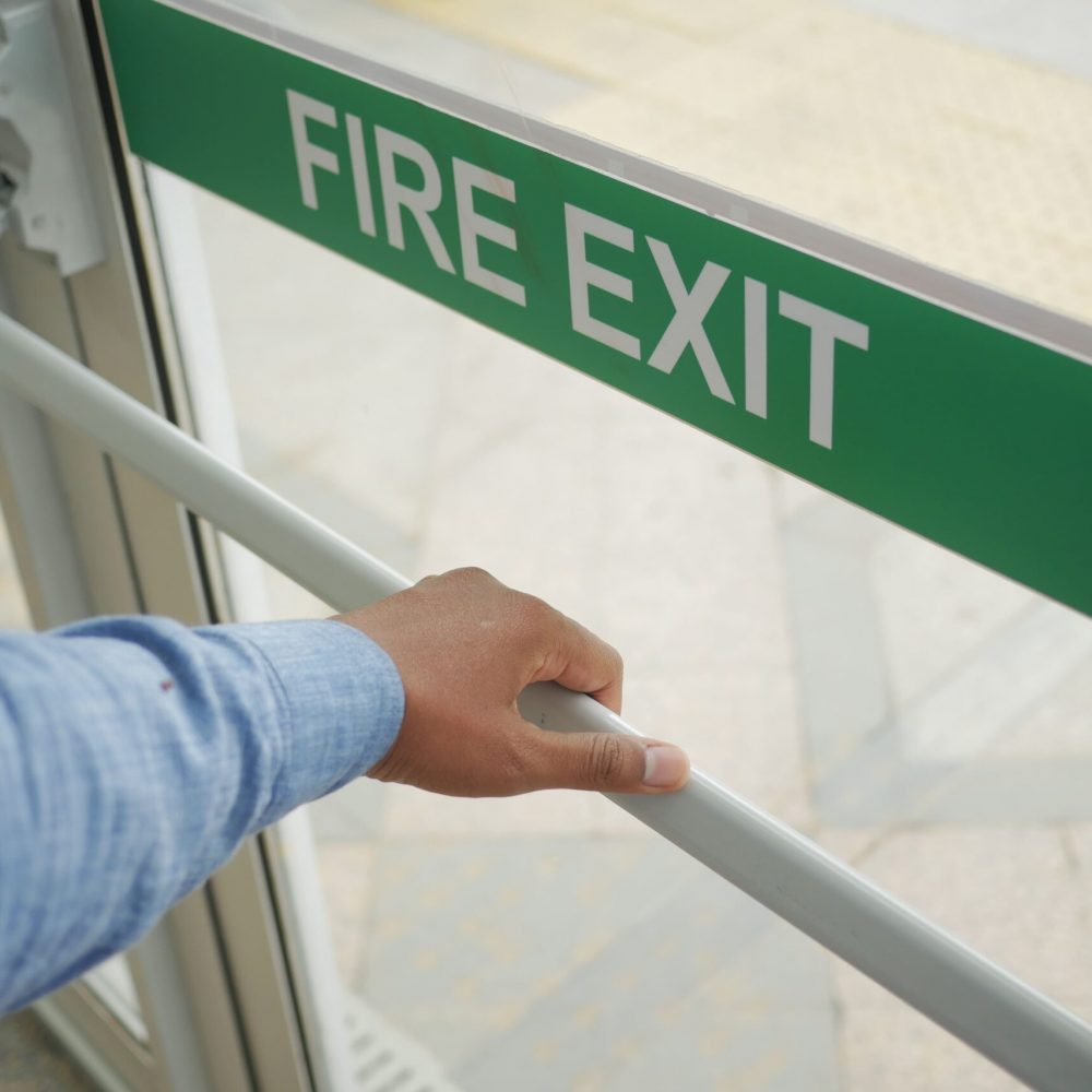 a-person-is-using-their-hand-to-open-a-fire-exit-d-2026-01-07-00-08-21-utc