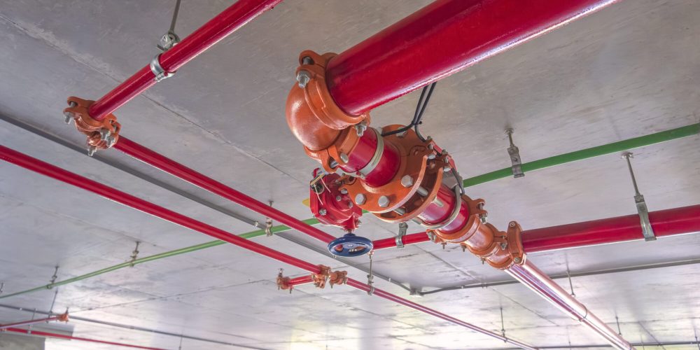 red-fire-protective-water-pipeline-system-on-concr-2025-03-11-14-12-25-utc (1)