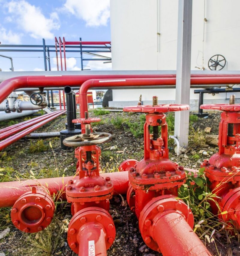 red-industrial-piping-valves-at-biofuel-plant-2026-01-09-09-27-12-utc